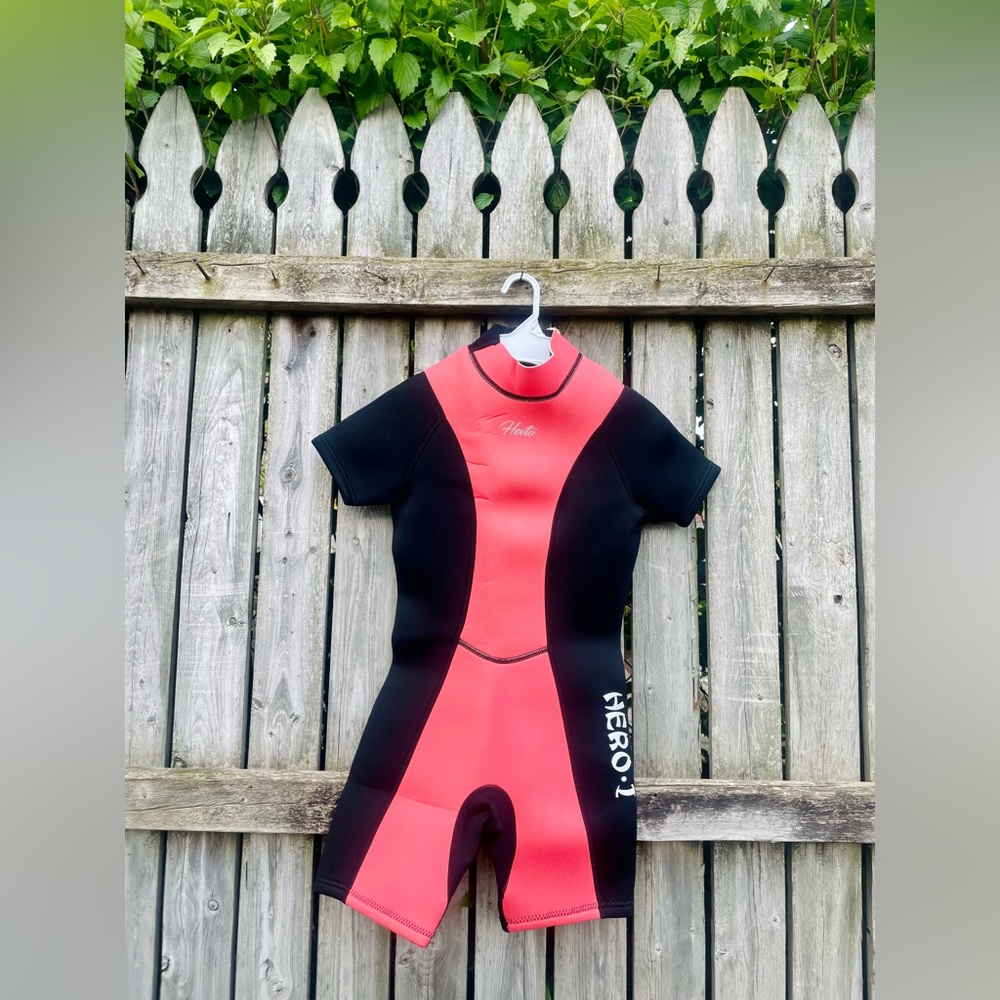NEW WITH TAGS! Never been worn, smoke free pet free youth wet suit.